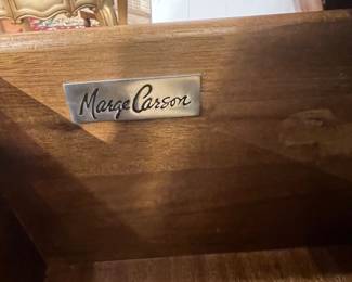 Marge Carson signature plaque on interior of cabinet furniture piece.