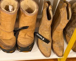 Tan shearling lined winter boots with thick rubber sole and suede upper.