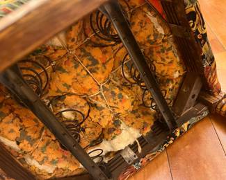 Antique carved oak dining chair with ornate crest and floral tapestry seat.