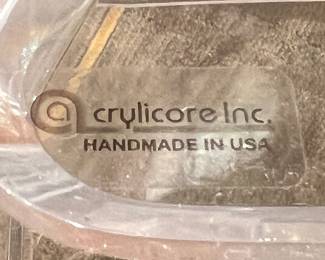 Modern glass console table with sculptural clear acrylic base in Art Deco style.