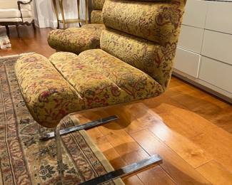 Vintage 1970s cantilever chrome lounge chair with floral upholstery in the style of Milo Baughman.