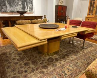 Expandable Mid-Century Oak Dining Table with Pull-Out Leaves and Pedestal Base.