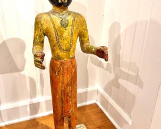 A carved and painted wooden folk sculpture of a turbaned man, likely South Asian decorative temple or guardian figure, circa early–mid 20th century.