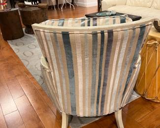 Curved Back Upholstered Accent Chair with Vertical Stripe Fabric and Painted Wood Frame.