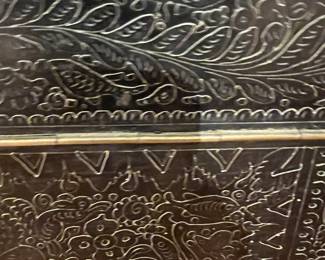 Embossed Decorative Trunk – Vintage style embossed black storage trunk with ornate floral and geometric detailing.