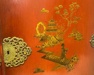 Antique Asian Red Lacquer Cabinet with Ornate Brass Hinges and Decorative Hardware.