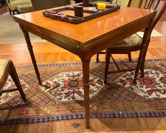Antique Barnard & Simonds Grand Rapids flip-top game table with interior storage compartment.