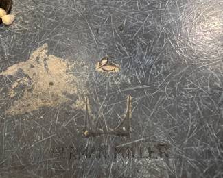 Mid-century molded fiberglass shell chair with metal legs in blue/gray finish.