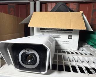 6134  FLIR Camera and Box Of Charging Cords 