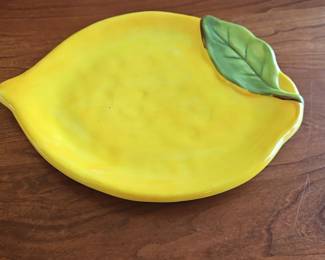 Lemon shaped ceramic plate with leaf accent