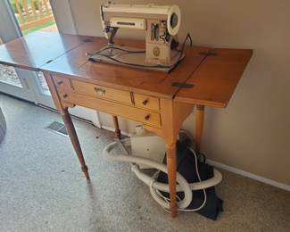 Singer sewing machine with cabinet/sweeper