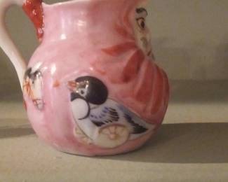 Pink Pitcher with Figural Decorations