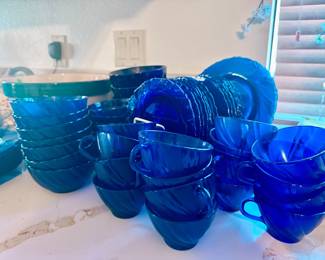 blue glass dishes and cups