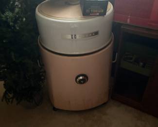 Pink vintage ringer washing machine