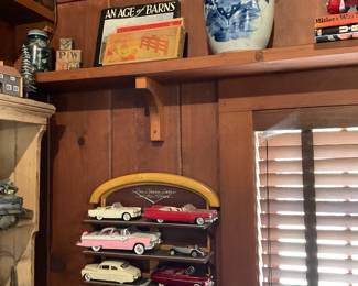 Model cars, blue & white jar