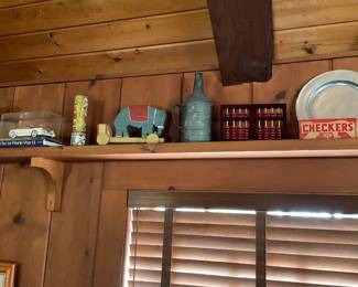 Model car in case, antique pull toy, jug, checkers