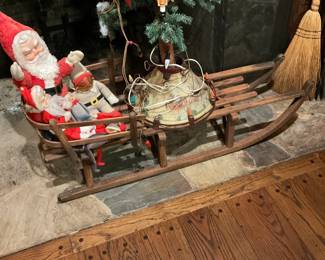 Santa Clause in wooden sleigh