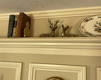 Brass deer, brass pineapple bookends, antique books