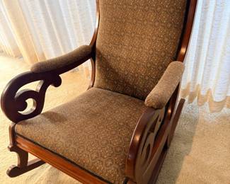 Antique upholstered rocking chair