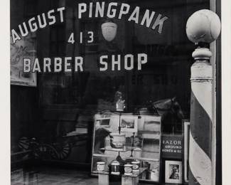 276 Berenice Abbott (1898-1991) "August Pingpank Barber Shop," circa 1936, from "New York Portfolio IV" Gelatin silver print on paper, dry mounted to a mat board support, as issued Edition: 58/60, printed circa 1979 Signed and numbered in pencil on the mount: Berenice Abbott; Parasol Press, Ltd., New York, NY, pub., with their black ink stamp on the verso of the mat board support Image/Sheet: 19.25" H x 15.25" W; Sight of mat board support: 21.5" x 17" W Estimate: $800 - $1,200
