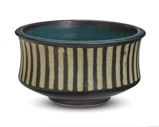 266 Harrison McIntosh (1914-2016) A glazed stoneware footed bowl, mid-20th century Impressed with potter's chop mark: HM; applied paper label to the underside: Handthrown Stoneware / Harrison McIntosh / Claremont / California With black and cream glazes 3.375" H x 5.75" Dia. Estimate: $600 - $800