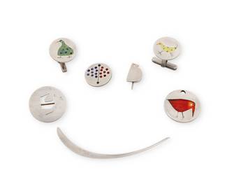 300 Betty Cooke: A collection of Modernist sterling silver jewelry Betty Cooke (1924-2024) Mid/late 20th century Six marked for maker; two marked for sterling Six works comprising a long narrow curved silver pendant (3" H), a small round enamel bird pendant (1" Dia.), a round openwork bird brooch (1" Dia.), two tie pins, one a bird motif, and one with enamel dots (each: 0.75" H), and a pair of cuff links with enamel bird motifs (0.75" Dia.) 7 pieces 40.5 grams gross Estimate: $200 - $400