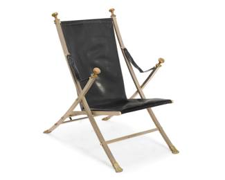 289 A folding campaign chair attributed to Maison Jansen Circa 1960s The steel X-frame with brass paw feet and upper terminal knobs, with leather seat cushion, sling back, and armrests 36.75" H x 24.75" W x 34.75" D Estimate: $500 - $700