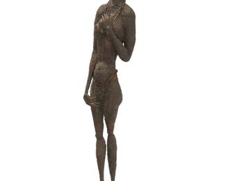 38 A Brutalist wrought metal standing figure Mid/late 20th century Signed indistinctly to underside of foot 64.5" H x 11.5" W x 13" D Estimate: $700 - $900