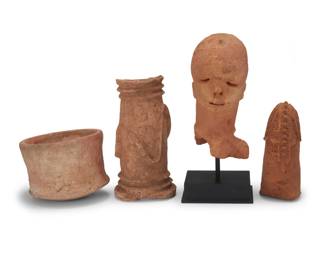 432 Four African terracotta pottery items 20th century or earlier Comprising a possibly Katsina head/bust fragment raised on an enameled metal stand, a possibly Bura Sinda Sikkaa pottery head, an incised pot, and a shaped cylinder 4 pieces Katsina Head: 11.5" H x 5.25" W x 6.5" D; Pot: 6.375" H x 8.5" Dia. Estimate: $400 - $600