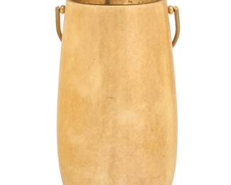 292 Aldo Tura (1909-1963) A tall champagne ice bucket, circa 1960s With applied label to underside: TU milano italia With lacquered goatskin-clad wood body and brass liner, lid, and handle 15.875" H x 8.25" W x 8" D Estimate: $200 - $400
