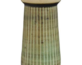 262 Harrison McIntosh (1914-2016) A glazed stoneware vase, mid-20th century Impressed with potter's chop mark: HM; applied paper label to the underside: Handthrown Stoneware / Harrison McIntosh / Claremont / California With pale green and cream glazes, and sgraffito lines 5.75" H x 3" Dia. Estimate: $600 - $800