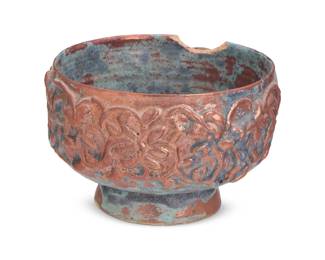 219 Beatrice Wood (1893-1998) A lustre glazed earthenware footed bowl, mid-20th century Signed to underside: BEATO Molded with foliate designs in relief 5.625" H x 9" Dia. Estimate: $700 - $900