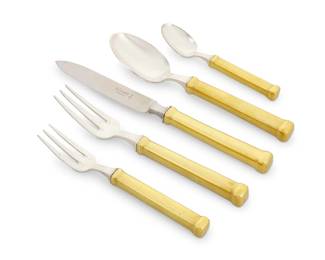303 A JL Coquet silver plated partial flatware service Late 20th/early 21st century Each impressed with maker's marks Each with gilt-metal handle Comprising: 11 dinner forks (8") 11 salad forks (6.875") 12 dinner knives (9.5") 12 oval soup spoons (8") 12 teaspoons (5.5") 58 pieces Estimate: $800 - $1,200