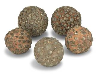318 Five pyrite specimen spheres 20th century Each fool's gold nugget set into a concrete matrix 5 pieces Largest: 5.375" Dia.; Smallest: 4" Dia. Estimate: $400 - $600