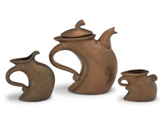 57 A Michael Lambert ceramic 'Dancing' tea service Mid/late 20th century Each signed on underside: Lambert Comprising: 1 teapot (11" H x 10.25" W x 4.5" D) 1 cream jug (7.25" H x 6.75" W x 3.125" D) 1 open sugar (4.5" H x 6" W x 2.75" D) 3 pieces Estimate: $300 - $500