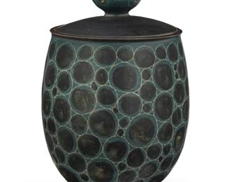 244 Harrison McIntosh (1914-2016) A glazed stoneware lidded jar, mid-20th century Impressed with potter's chop mark: HM; applied paper label to the underside: Handthrown Stoneware / Harrison McIntosh / Claremont / California With cerulean blue glaze and mishima circles 9.5" H x 6" Dia. Estimate: $4,000 - $6,000
