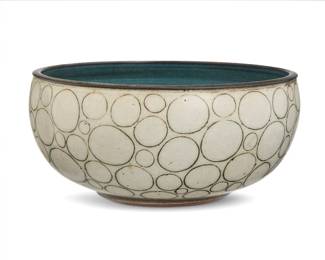 246 Harrison McIntosh (1914-2016) A glazed stoneware bowl, mid-20th century Impressed with potter's chop mark: HM; applied paper label to the underside: Handthrown Stoneware / Harrison McIntosh / Claremont / California With cream glaze and mishima circles 4" H x 8.75" Dia. Estimate: $2,500 - $3,500