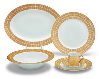 306 A Marc Blackwell porcelain 'Palazzo' dinner service Early 21st century Each with printed factory mark and pattern Comprising: 16 dinner plates (10.75") 16 salad plates (8.125") 12 demitasse cups (2.5" H) 12 saucers (4.875") 2 serving bowls (10.375") 2 oval serving platters (14.75" W x 10.875" D) 60 pieces Estimate: $1,000 - $1,500