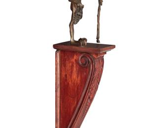 39 Eric Aman (20th/21st Century) Fantastical figure Patinated bronze sculpture on a wood wall bracket Unmarked Figure: 12" H x 6" W x 6" D; Wood: 20.25" H x 5.25" W x 8.875" D Estimate: $800 - $1,200