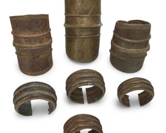 429 A group of Ekonda brass anklets and West African cuffs 19th/20th century Comprising three anklets and four cuff bracelets 7 pieces Largest anklet: 10" H x 5.5" W x 6" D; Smallest cuff: 2.375" H x 4.25 W x 4" D Estimate: $400 - $500