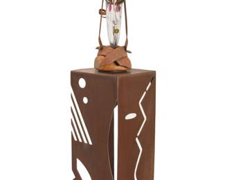 37 Chris Hawthorne (b. 1953) and Steve Kuntz (b. 20th Century) A "Geisha" sculpture, late 20th century Signed to underside of head: S. Kuntz; incised: CS108982 Glass, metal, and wood on a stylized metal plinth 2 pieces Head: 28.75" H x 15.75" W x 11" D; Plinth: 38" H x 18" W x 17" D Estimate: $1,000 - $1,500