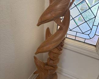 Wooden dolphin statue