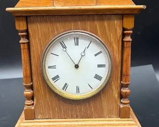 Vintage Germanmade wooden mantel clock with an oak case