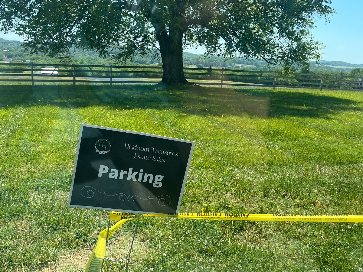 Park to the left of the caution tape. Enter at the beginning of the tape and exit at the end. DO NOT drive over the tape. You will damage the driveway and your car. 