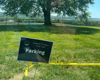 Park to the left of the caution tape. Enter at the beginning of the tape and exit at the end. DO NOT drive over the tape. You will damage the driveway and your car. 