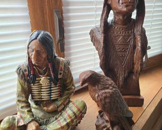 Native American and bird carvings