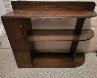 Carved bookcase with curved end