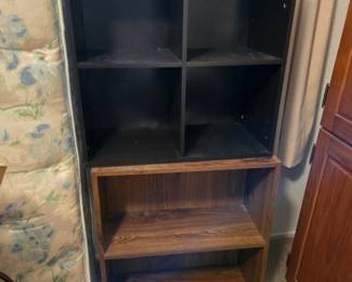 Set of 4 cubes on top of a small bookcase