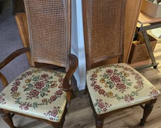 Close up of dining chairs - there are 2 with arms and 4 without