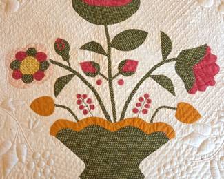 Detail of Antique Trapunto stitched hand made flower basket quilt
